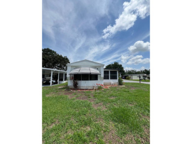 Charming home located in highly sought after Hidden Golf Club on Lake Henry Golf Club in Florida - for sale on GolfHomes.com, golf home, golf lot