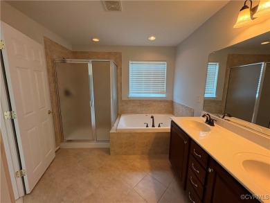 Welcome to this spacious and well-appointed townhome in the on The Tradition Golf Club At The Crossings in Virginia - for sale on GolfHomes.com, golf home, golf lot