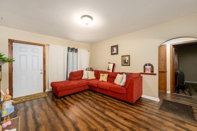 Welcome home to this charming 3-bedroom home with a spacious on L W Clapp Memorial Golf Course in Kansas - for sale on GolfHomes.com, golf home, golf lot