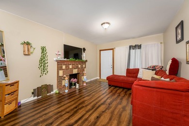 Welcome home to this charming 3-bedroom home with a spacious on L W Clapp Memorial Golf Course in Kansas - for sale on GolfHomes.com, golf home, golf lot