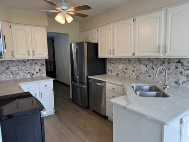 This rare first-floor 2-bedroom, 2-bath condo offers one of the on Oak Hills Country Club in Illinois - for sale on GolfHomes.com, golf home, golf lot