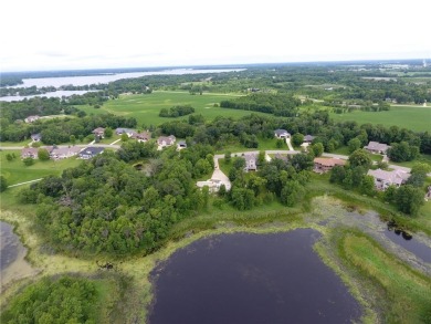 Nestled on a prime .82-acre parcel just steps from the serene on Geneva Golf Club in Minnesota - for sale on GolfHomes.com, golf home, golf lot