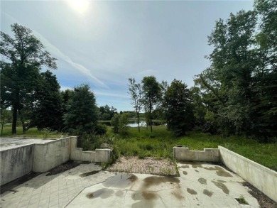 Nestled on a prime .82-acre parcel just steps from the serene on Geneva Golf Club in Minnesota - for sale on GolfHomes.com, golf home, golf lot