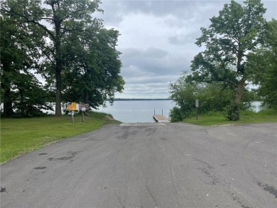 Nestled on a prime .82-acre parcel just steps from the serene on Geneva Golf Club in Minnesota - for sale on GolfHomes.com, golf home, golf lot