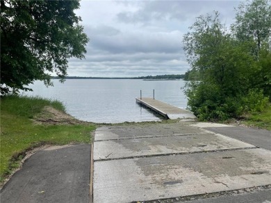 Nestled on a prime .82-acre parcel just steps from the serene on Geneva Golf Club in Minnesota - for sale on GolfHomes.com, golf home, golf lot