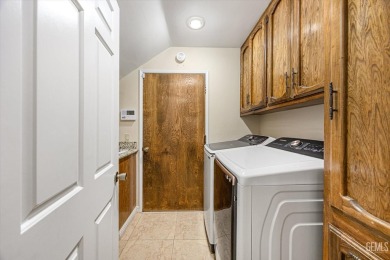 Stunning 4 bedroom, 3 bathroom home sitting on just shy of a on Kern River Golf Course in California - for sale on GolfHomes.com, golf home, golf lot