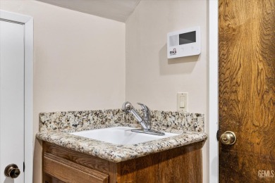 Stunning 4 bedroom, 3 bathroom home sitting on just shy of a on Kern River Golf Course in California - for sale on GolfHomes.com, golf home, golf lot