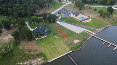 Exceptional waterfront lot in a prestigious gated community! on Cedar Creek Country Club in Texas - for sale on GolfHomes.com, golf home, golf lot