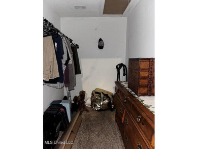 Nestled on two spacious lots, this charming 3-bedroom, 2-bath on The Kings Arrow Ranch in Mississippi - for sale on GolfHomes.com, golf home, golf lot