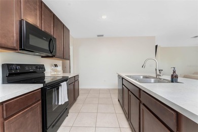 Step into this beautiful, like-new modern 4-bedroom, 2-bath home on Deep Creek Golf Club in Florida - for sale on GolfHomes.com, golf home, golf lot