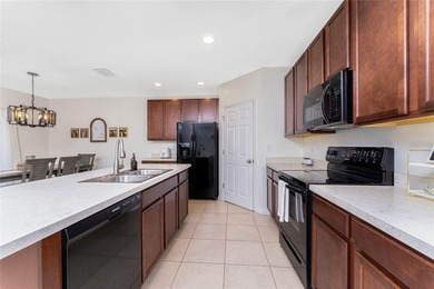 Step into this beautiful, like-new modern 4-bedroom, 2-bath home on Deep Creek Golf Club in Florida - for sale on GolfHomes.com, golf home, golf lot