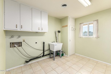 Welcome to relaxed desert living in the heart of Sun City, one on Sun City Lakes West and East in Arizona - for sale on GolfHomes.com, golf home, golf lot