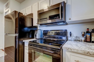 Discover this light-filled and spacious end-unit condo in the on Feather Sound Country Club in Florida - for sale on GolfHomes.com, golf home, golf lot