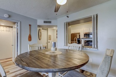 Discover this light-filled and spacious end-unit condo in the on Feather Sound Country Club in Florida - for sale on GolfHomes.com, golf home, golf lot