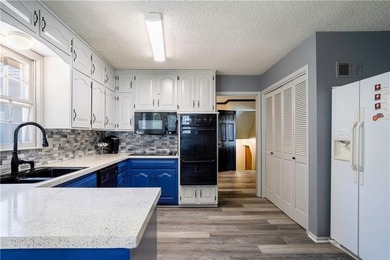 This spacious 4-bedroom residence offers exceptionally large on National Golf Club of Kansas City in Missouri - for sale on GolfHomes.com, golf home, golf lot