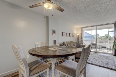 Discover this light-filled and spacious end-unit condo in the on Feather Sound Country Club in Florida - for sale on GolfHomes.com, golf home, golf lot