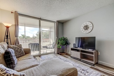 Discover this light-filled and spacious end-unit condo in the on Feather Sound Country Club in Florida - for sale on GolfHomes.com, golf home, golf lot