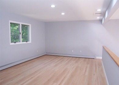 This beautiful 3 bedroom home sits right across from a scenic on St Georges Golf and Country Club in New York - for sale on GolfHomes.com, golf home, golf lot