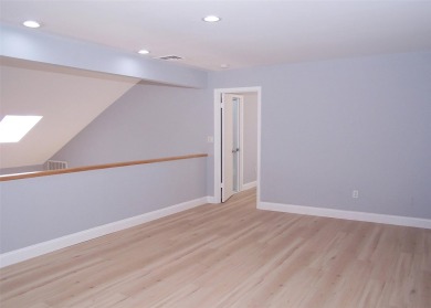This beautiful 3 bedroom home sits right across from a scenic on St Georges Golf and Country Club in New York - for sale on GolfHomes.com, golf home, golf lot