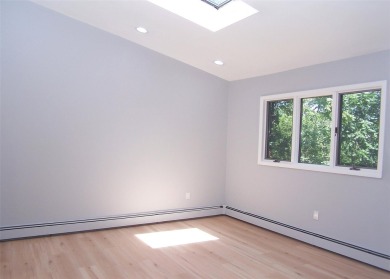 This beautiful 3 bedroom home sits right across from a scenic on St Georges Golf and Country Club in New York - for sale on GolfHomes.com, golf home, golf lot