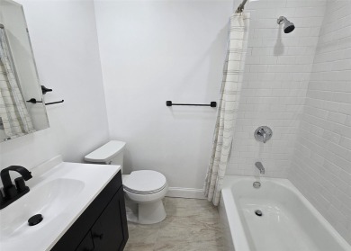This beautiful 3 bedroom home sits right across from a scenic on St Georges Golf and Country Club in New York - for sale on GolfHomes.com, golf home, golf lot
