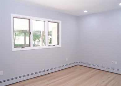 This beautiful 3 bedroom home sits right across from a scenic on St Georges Golf and Country Club in New York - for sale on GolfHomes.com, golf home, golf lot