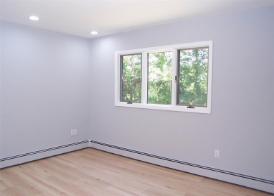 This beautiful 3 bedroom home sits right across from a scenic on St Georges Golf and Country Club in New York - for sale on GolfHomes.com, golf home, golf lot