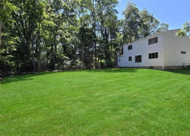 This beautiful 3 bedroom home sits right across from a scenic on St Georges Golf and Country Club in New York - for sale on GolfHomes.com, golf home, golf lot