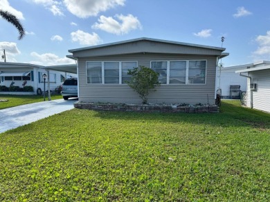 Welcome to this charming and inviting1967 double-wide home, With on Heather Hills Golf Course in Florida - for sale on GolfHomes.com, golf home, golf lot