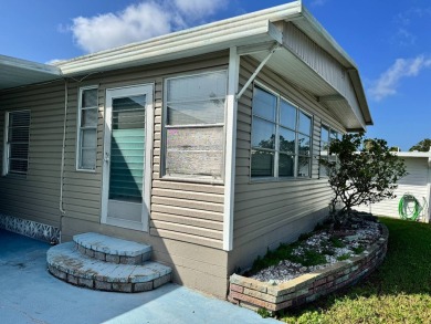 Welcome to this charming and inviting1967 double-wide home, With on Heather Hills Golf Course in Florida - for sale on GolfHomes.com, golf home, golf lot