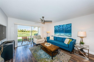 Come check out this desirable first floor furnished designer on Isla Del Sol Yacht and Country Club in Florida - for sale on GolfHomes.com, golf home, golf lot