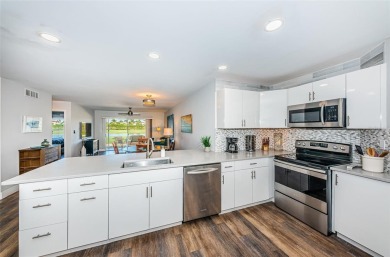 Come check out this desirable first floor furnished designer on Isla Del Sol Yacht and Country Club in Florida - for sale on GolfHomes.com, golf home, golf lot