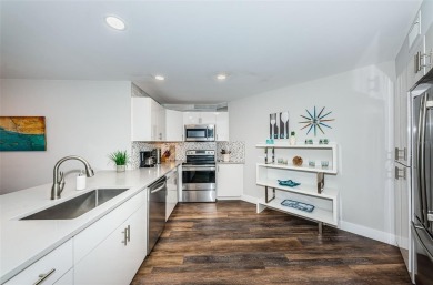 Come check out this desirable first floor furnished designer on Isla Del Sol Yacht and Country Club in Florida - for sale on GolfHomes.com, golf home, golf lot