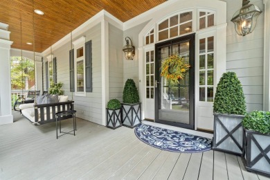 This stunning custom home overlooks the 8th fairway and green of on Reynolds Lake Oconee - The Oconee in Georgia - for sale on GolfHomes.com, golf home, golf lot