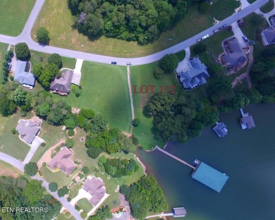 Want to be on the water with a dock right in your back yard but on Rarity Bay Country Club - Loudon in Tennessee - for sale on GolfHomes.com, golf home, golf lot