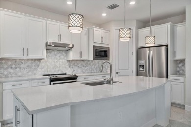HEATED SALTWATER POOL WITH WATERFALL - EXPANDED LANAI - GOLF on River Hall Country Club in Florida - for sale on GolfHomes.com, golf home, golf lot