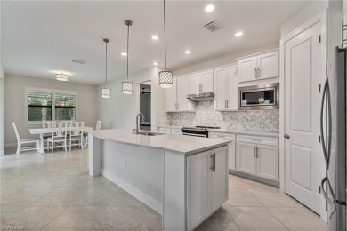 HEATED SALTWATER POOL WITH WATERFALL - EXPANDED LANAI - GOLF on River Hall Country Club in Florida - for sale on GolfHomes.com, golf home, golf lot