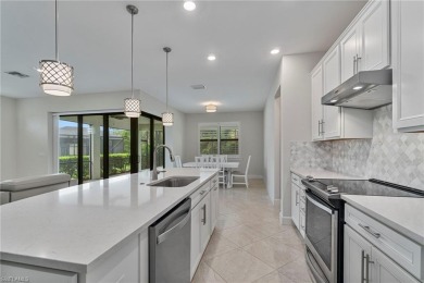 HEATED SALTWATER POOL WITH WATERFALL - EXPANDED LANAI - GOLF on River Hall Country Club in Florida - for sale on GolfHomes.com, golf home, golf lot