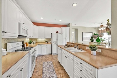 Welcome to a home designed for effortless living. Nestled within on Mile Square Golf Course in California - for sale on GolfHomes.com, golf home, golf lot