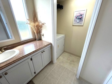 This bright home has been lovingly remodeled bringing modern on Crystal Lake Club in Florida - for sale on GolfHomes.com, golf home, golf lot
