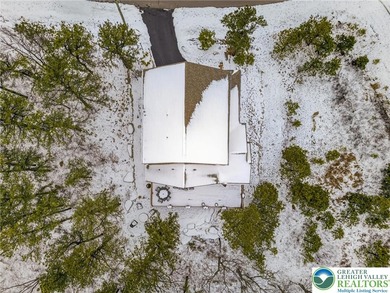 Experience elevated mountain living in this refined 4-bedroom on Eagle Rock Golf and Ski Resort in Pennsylvania - for sale on GolfHomes.com, golf home, golf lot