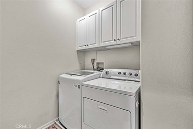 Welcome to a home designed for effortless living. Nestled within on Mile Square Golf Course in California - for sale on GolfHomes.com, golf home, golf lot