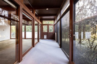 Extraordinary Mid-Century Modern home in the highly desired on Mark Bostick Golf Course At University of Florida in Florida - for sale on GolfHomes.com, golf home, golf lot