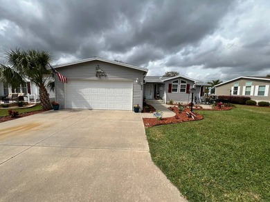 Beautifully maintained, unique, spacious open floorplan, located on Water Oak Country Club Estates in Florida - for sale on GolfHomes.com, golf home, golf lot