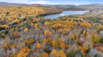 This lovely 4-bedroom, 4-bath home in Eastman features an open on Eastman Golf Links in New Hampshire - for sale on GolfHomes.com, golf home, golf lot