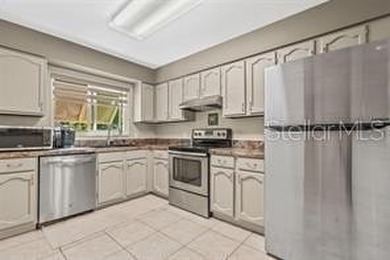 This sunny 2nd Floor condo turnkey furnished, has been remodeled on The Meadows Golf and Country Club in Florida - for sale on GolfHomes.com, golf home, golf lot