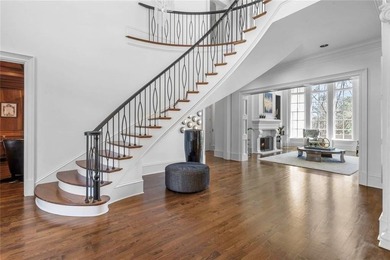 This extraordinary estate in the prestigious Windward community on The Golf Club of Georgia in Georgia - for sale on GolfHomes.com, golf home, golf lot