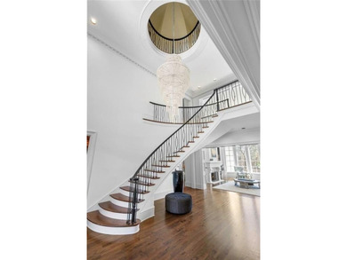 This extraordinary estate in the prestigious Windward community on The Golf Club of Georgia in Georgia - for sale on GolfHomes.com, golf home, golf lot