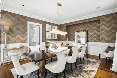 This extraordinary estate in the prestigious Windward community on The Golf Club of Georgia in Georgia - for sale on GolfHomes.com, golf home, golf lot