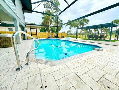 Discover refined living in this exceptional three-story on Alden Pines Golf Club in Florida - for sale on GolfHomes.com, golf home, golf lot